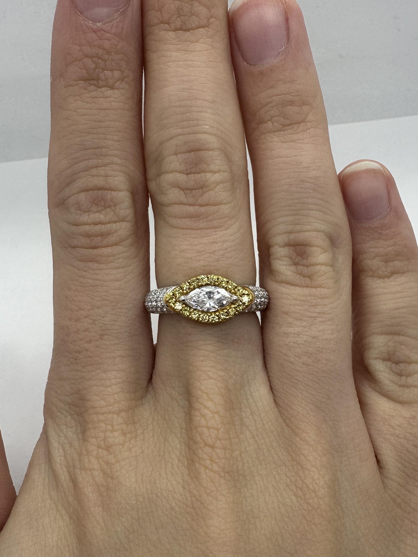 18k East-West Marquise Shaped Diamond Center and Yellow Diamond Halo Ring