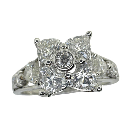 18k Diamond Ring with Floral Design and Side Heart Shaped Diamonds.