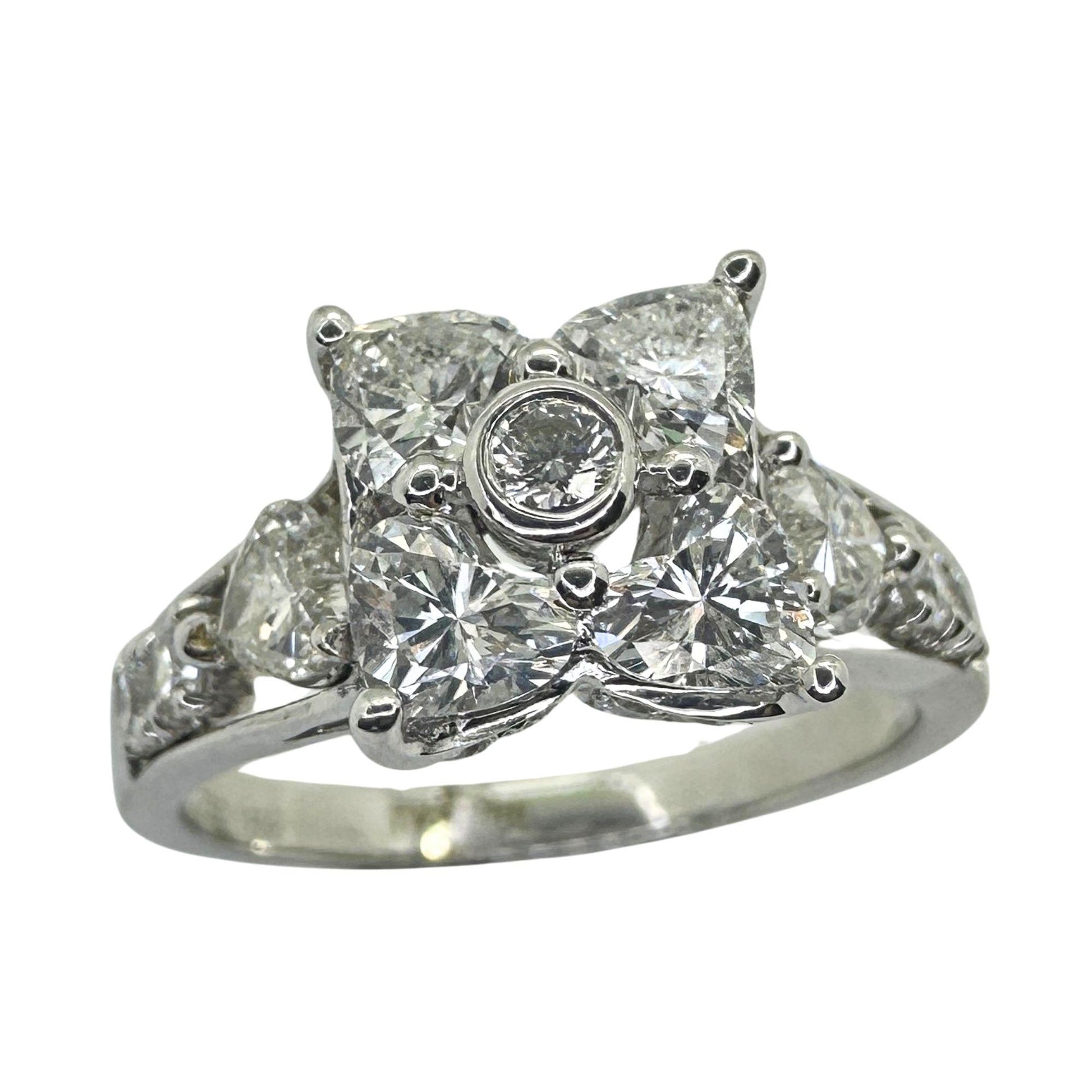 18k Diamond Ring with Floral Design and Side Heart Shaped Diamonds.