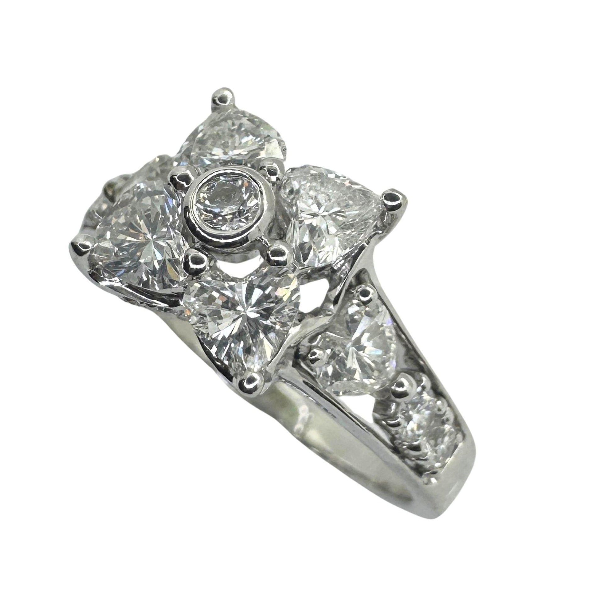 18k Diamond Ring with Floral Design and Side Heart Shaped Diamonds.