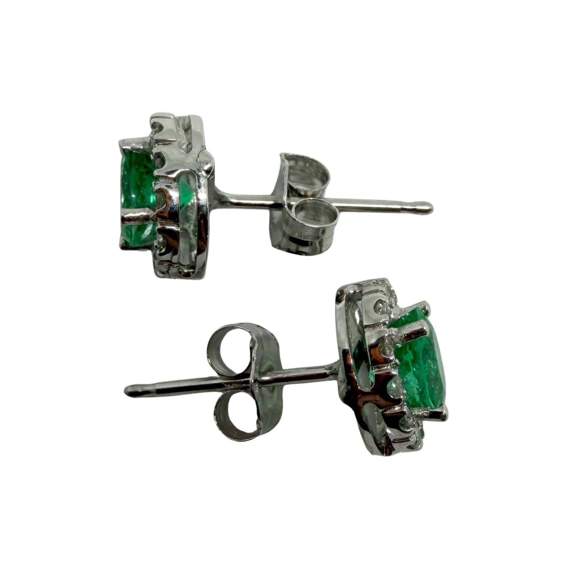 18K White Gold Diamond and .76 Carat Oval Emerald Cluster Stud Earrings